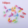 A collection of 100 colorful plastic sewing clips in various colors like pink, yellow, blue, and red.