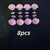 A set of eight pink no-sew silicone quilt clips arranged in two rows on a dark background.