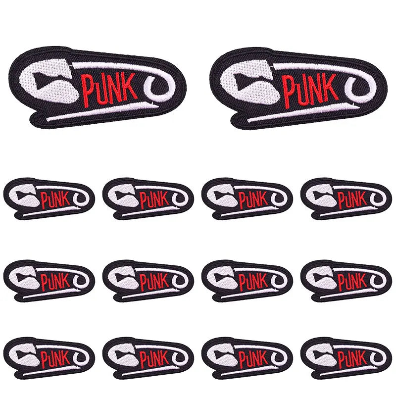 A set of black and white embroidered applique patches featuring the word PUNK in red text