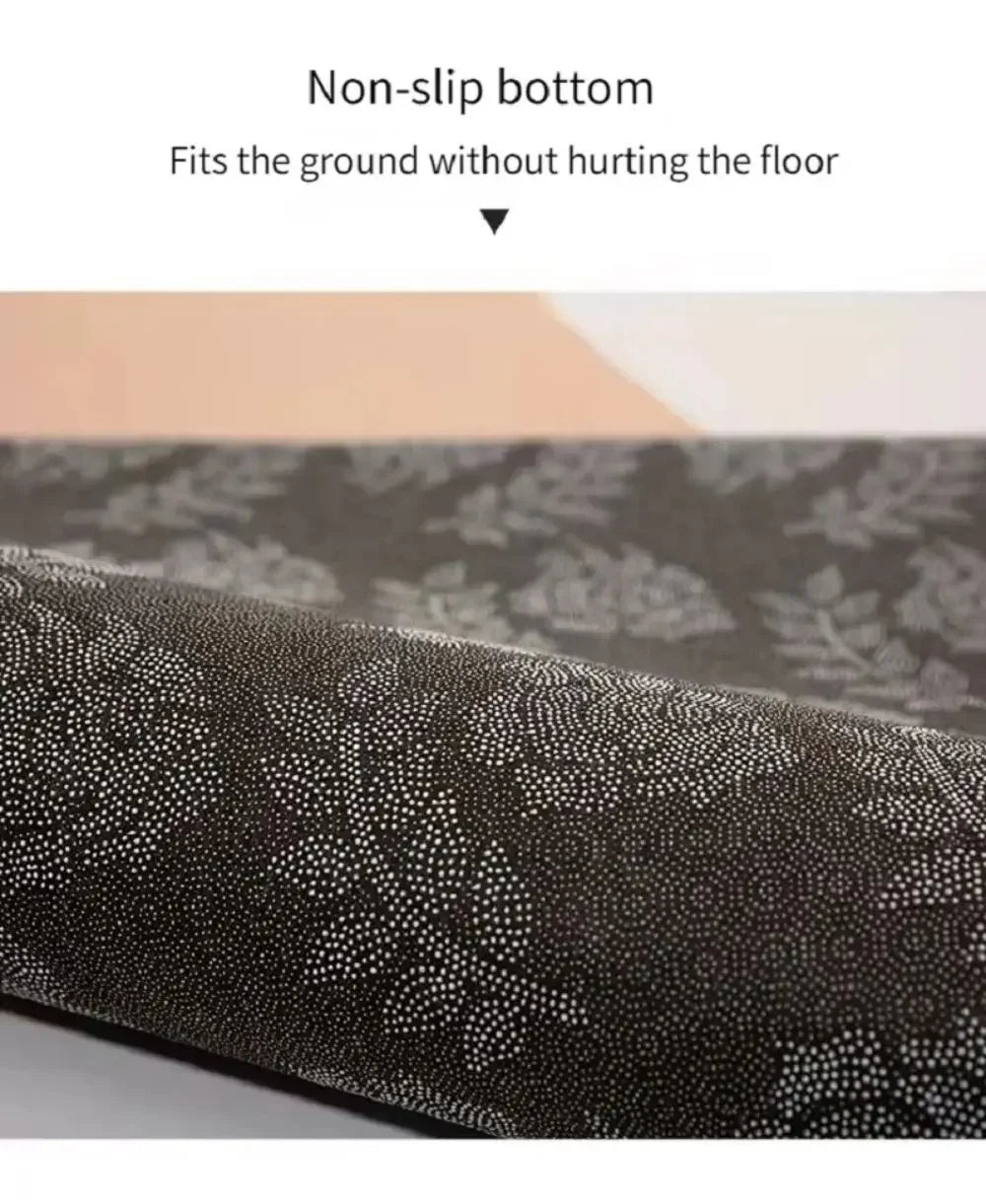 Close-up view of a dark patterned non-slip decorative floor mat rolled up.
