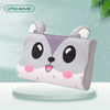 A cute little mouse shaped memory foam neck pillow with gray and white fur on a light green background.