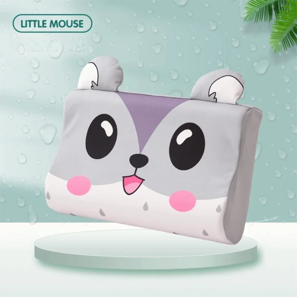 A cute little mouse shaped memory foam neck pillow with gray and white fur on a light green background.