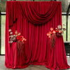 A vibrant red velvet drape used for stage or event decoration.