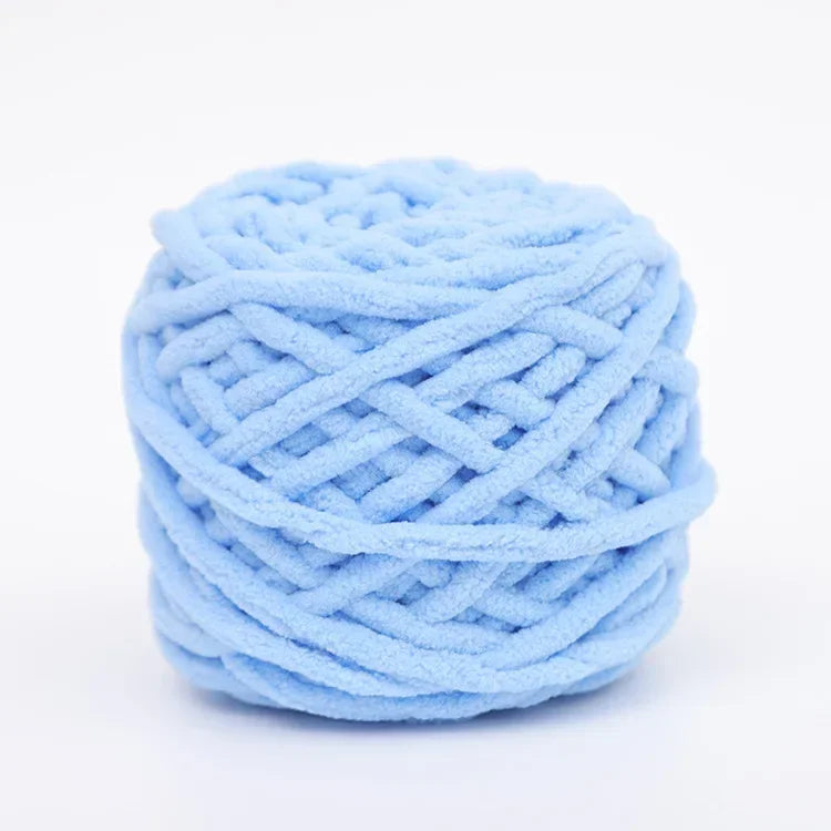 A ball of light blue soft chenille knitting yarn for hand crafting