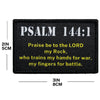 Black embroidered combat patch badge with Psalm 144:1 text on it.