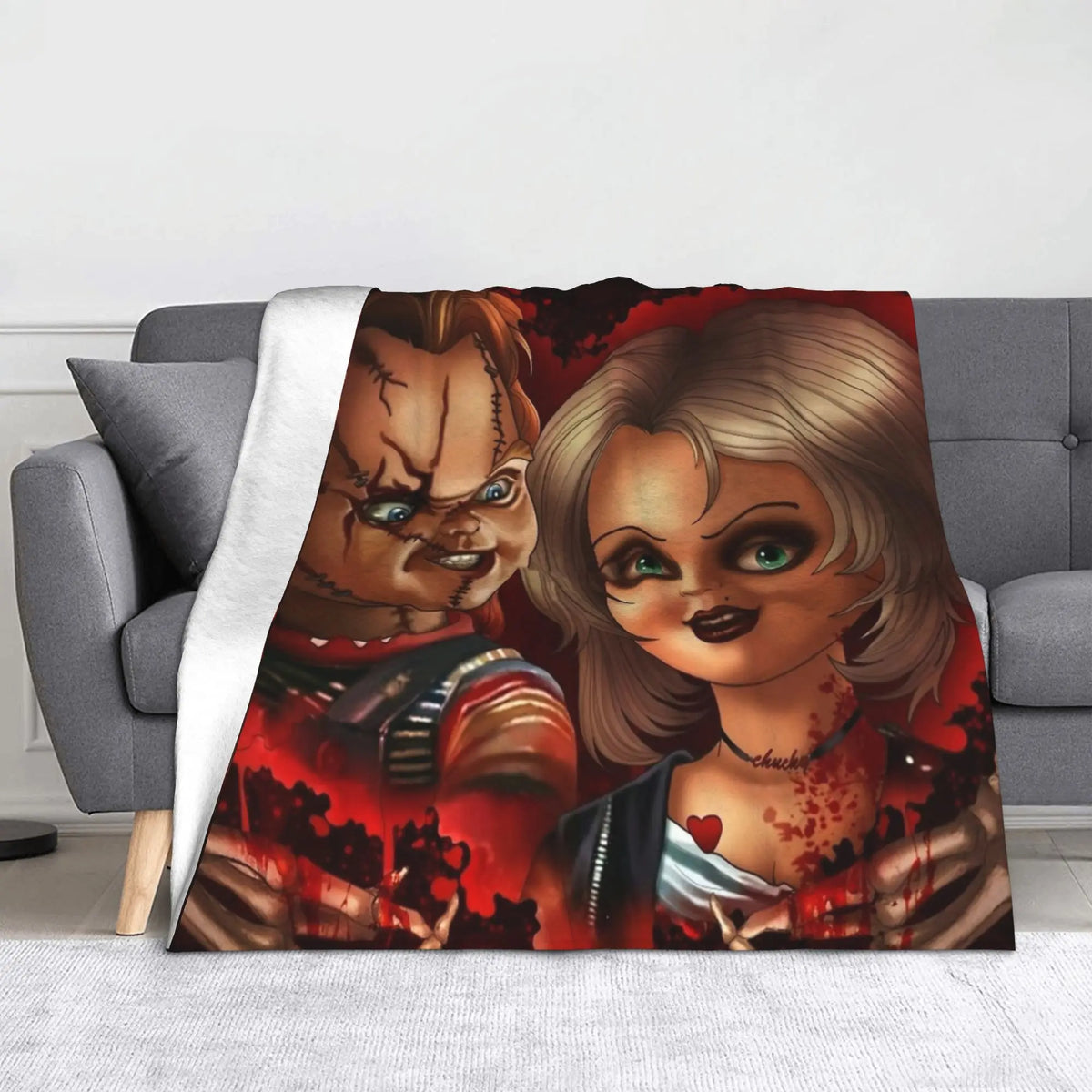 A print featuring Chucky from the horror movie, displayed as a flannel throw blanket.