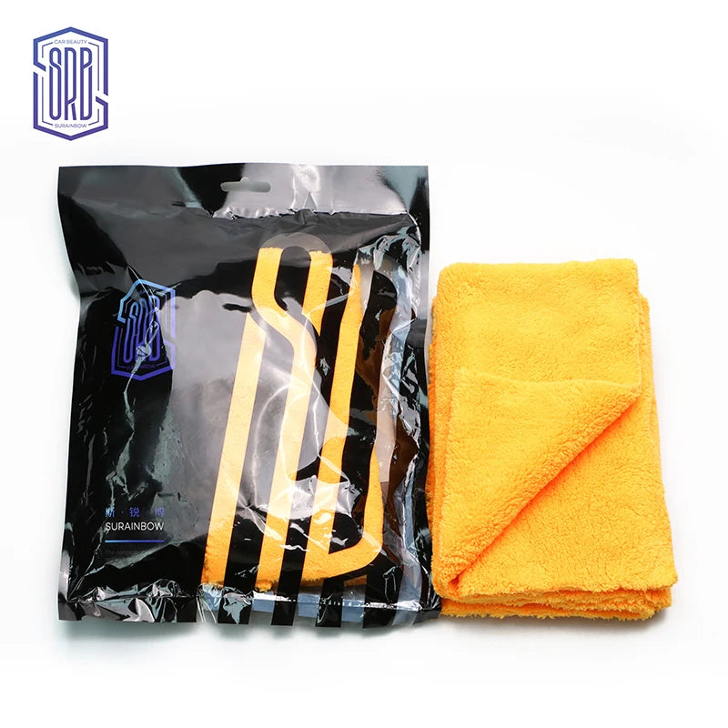 A black package of coral fleece microfiber cleaning cloths with yellow handles and a bright orange towel.