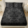 Black floral skull patterned bed sheet set featuring intricate designs on a bed.