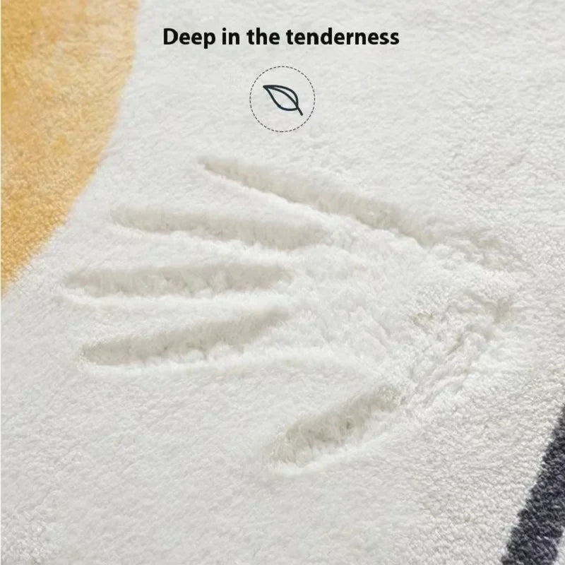 Close-up of a white rug showing a handprint design with the text Deep in the tenderness