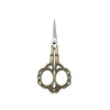 A pair of durable stainless steel crafting scissors with ornate gold-toned handles and a silver blade.
