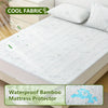 A waterproof bamboo mattress protector is shown on a white bed, highlighting its cooling fabric and deep pocket design.