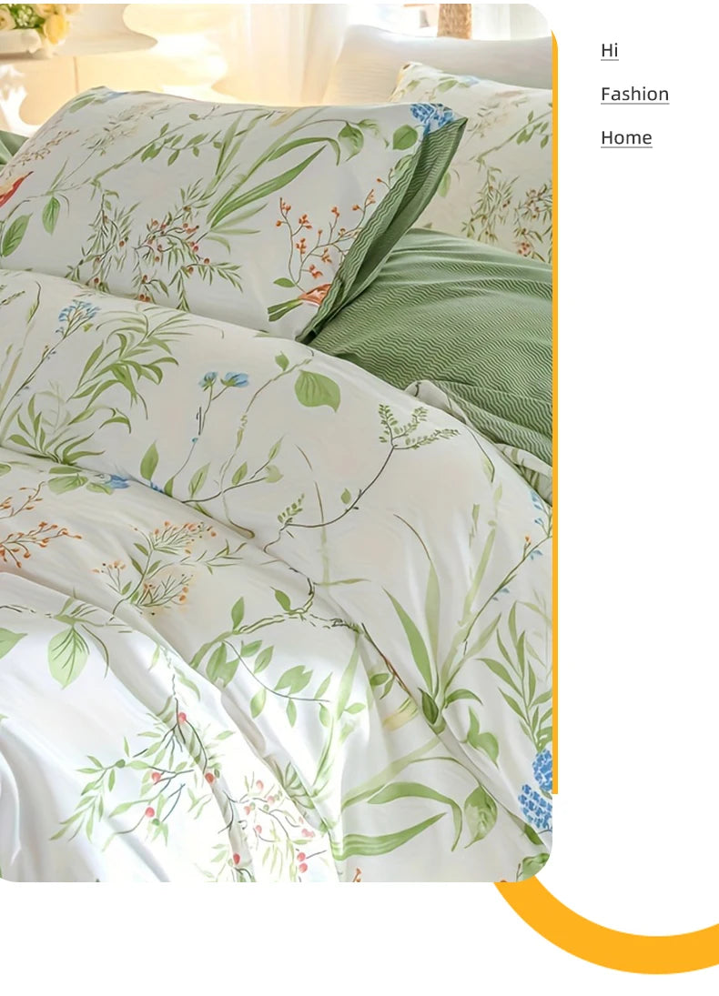 A white duvet cover set featuring a green and white leaf floral pattern on bedding.