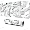 A rolled up large art vortex mouse pad featuring a gray and white marbled pattern.