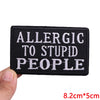 Black embroidered patch with white text that reads ALLERGIC TO STUPID PEOPLE