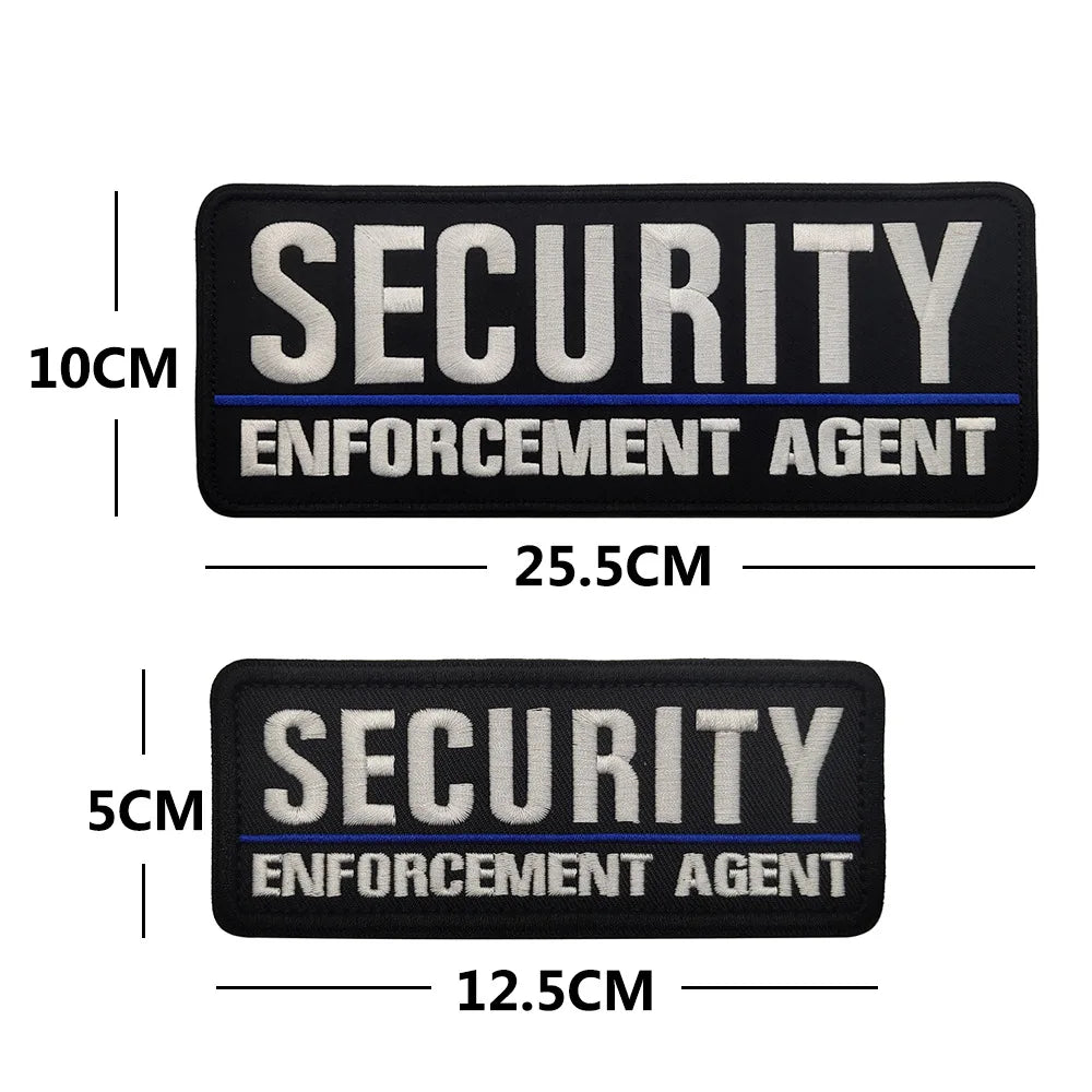 Black embroidered security enforcement agent patch with white and blue text
