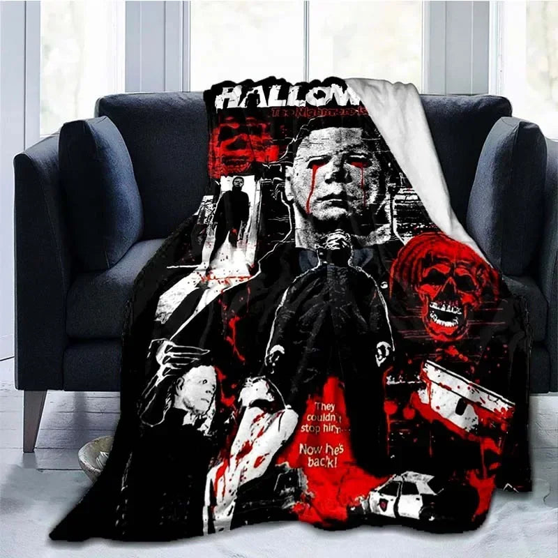 A black and red horror themed throw blanket featuring a graphic of Michael Myers.