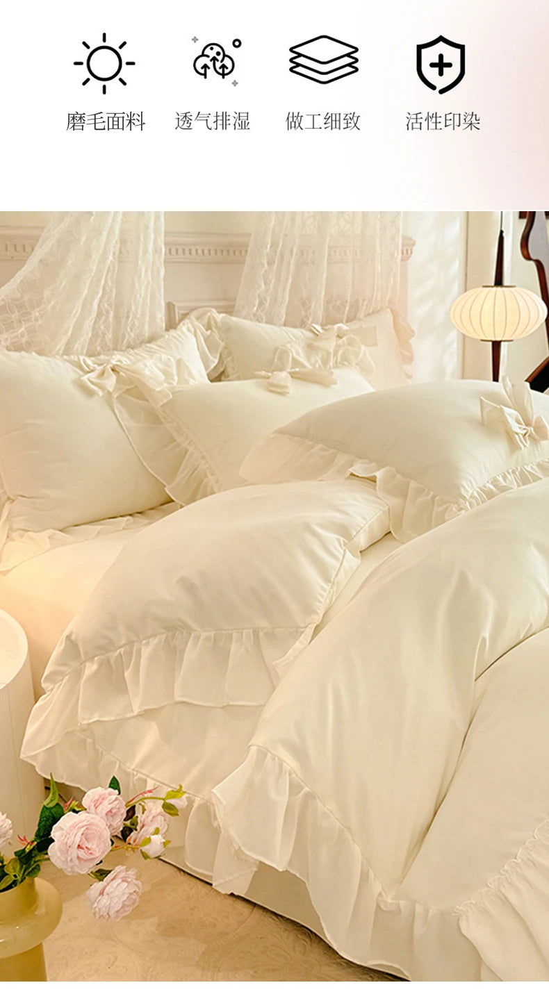 A set of white princess chiffon duvet covers and pillowcases with ruffled edges shown on a bed.
