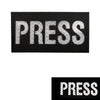 Black embroidered patch with the word PRESS in white stitching.
