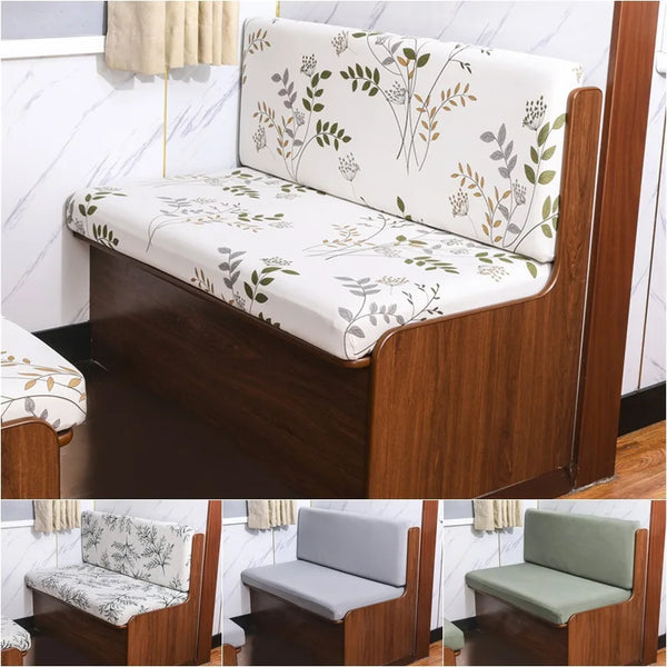 A set of floral patterned slipcovers for an RV dinette seat with wooden framing and light upholstery.