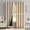 Two beige blackout grommet curtains hanging in a window frame.