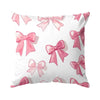 Decorative pillow cover featuring a pattern of pink bows on a white background.