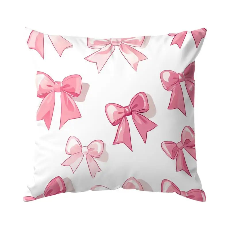 Decorative pillow cover featuring a pattern of pink bows on a white background.