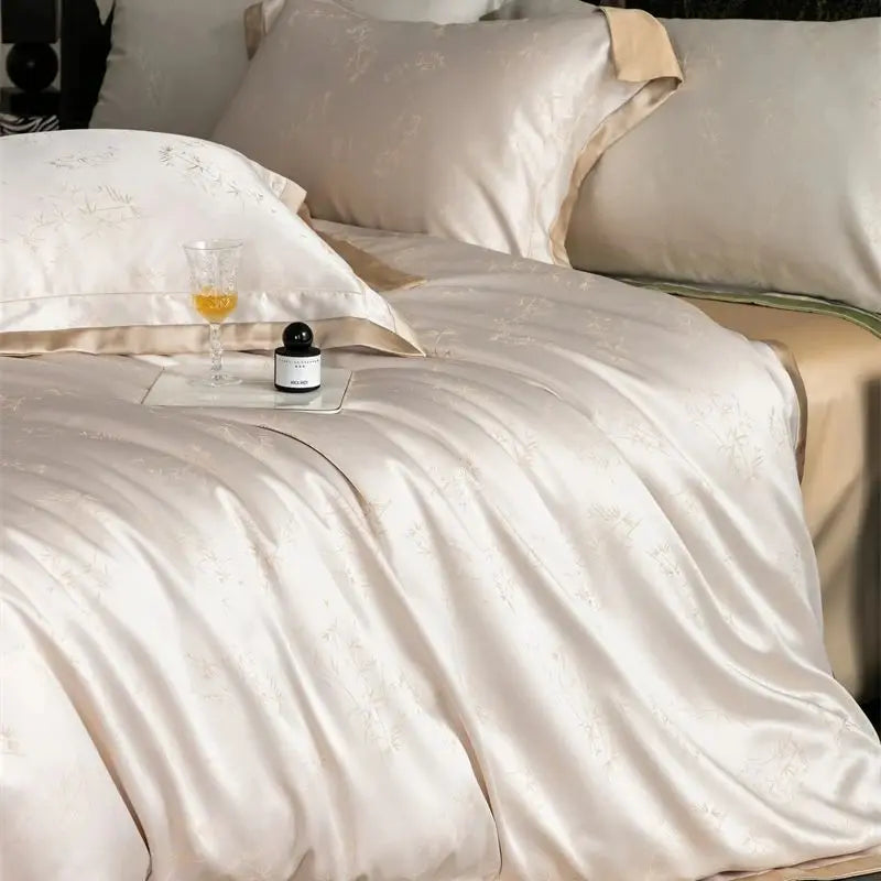 Luxury Lyocell Eucalyptus bedding set featuring soft beige sheets, pillows, and a glass of amber liquid.