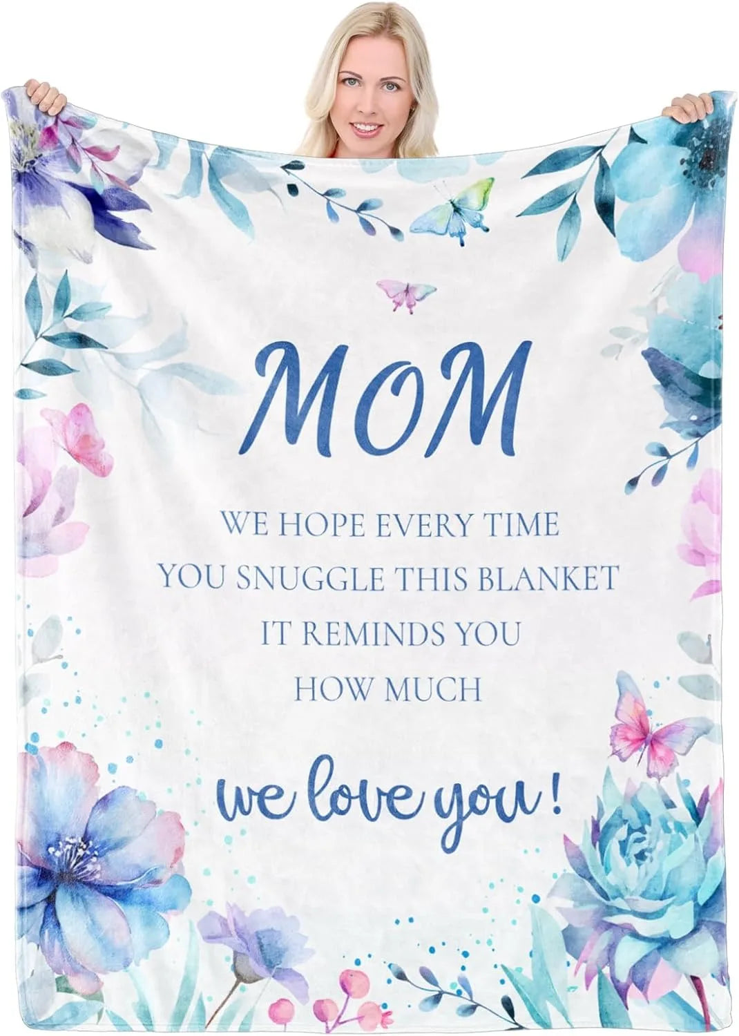 A white blanket featuring watercolor floral designs and the text "Mom we love you"