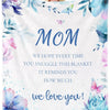 A watercolor blanket featuring floral and butterfly designs with the text We love you!