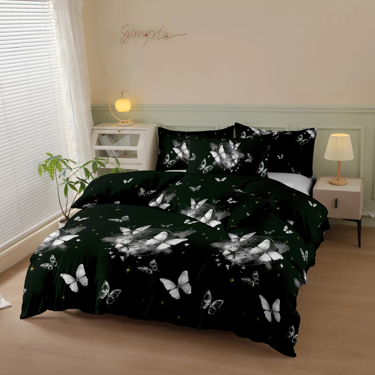 A dark green duvet cover set with a white butterfly print displayed on a bed in a bright room.