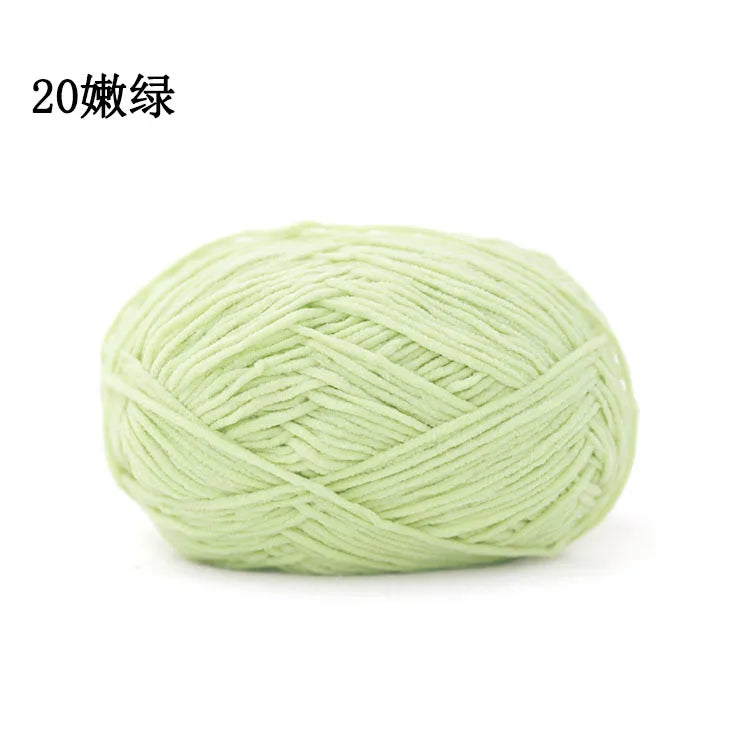 A ball of light green 3mm matte chenille yarn for knitting and crochet.