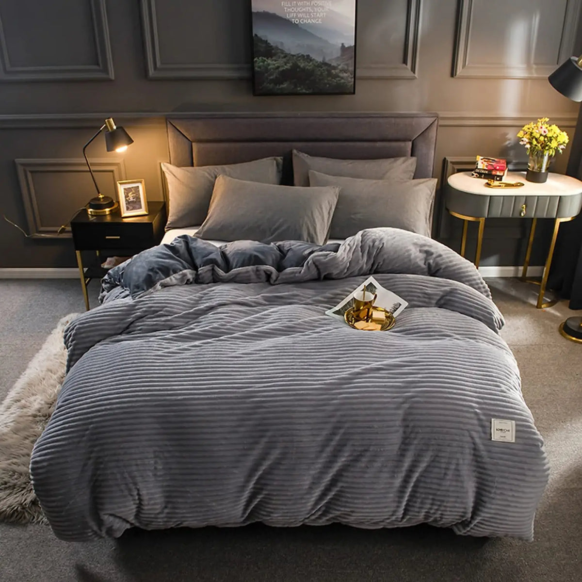 A gray ultra-soft corduroy duvet cover set displayed on a bed with neutral bedding and dark wood accents.