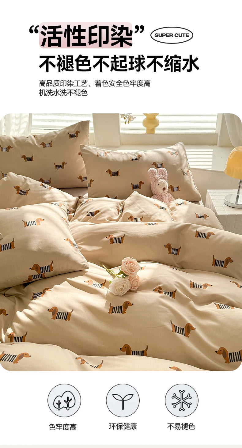 A set of beige duvet covers featuring a cute dog print pattern, displayed on a bed.