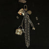 A silver star-shaped pocket watch keychain featuring a round clock face and a chain.