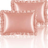 A set of two ruffled satin pillowcases in a dusty rose color with silky envelope closures.
