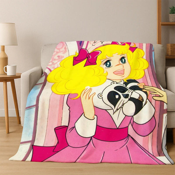 A cartoon character with yellow hair and pink attire is featured on a flannel blanket.