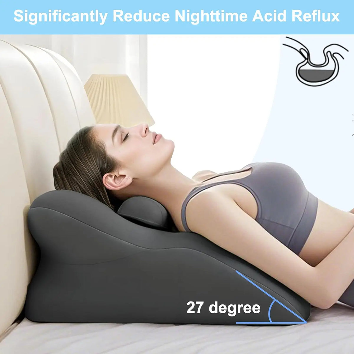 A person is lying down using a gray memory foam wedge pillow for back support and leg elevation.
