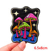 Colorful embroidered letter patches featuring various mushrooms on a black background