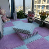 A purple and blue interlocking puzzle rug mat with plush toys and a window view.
