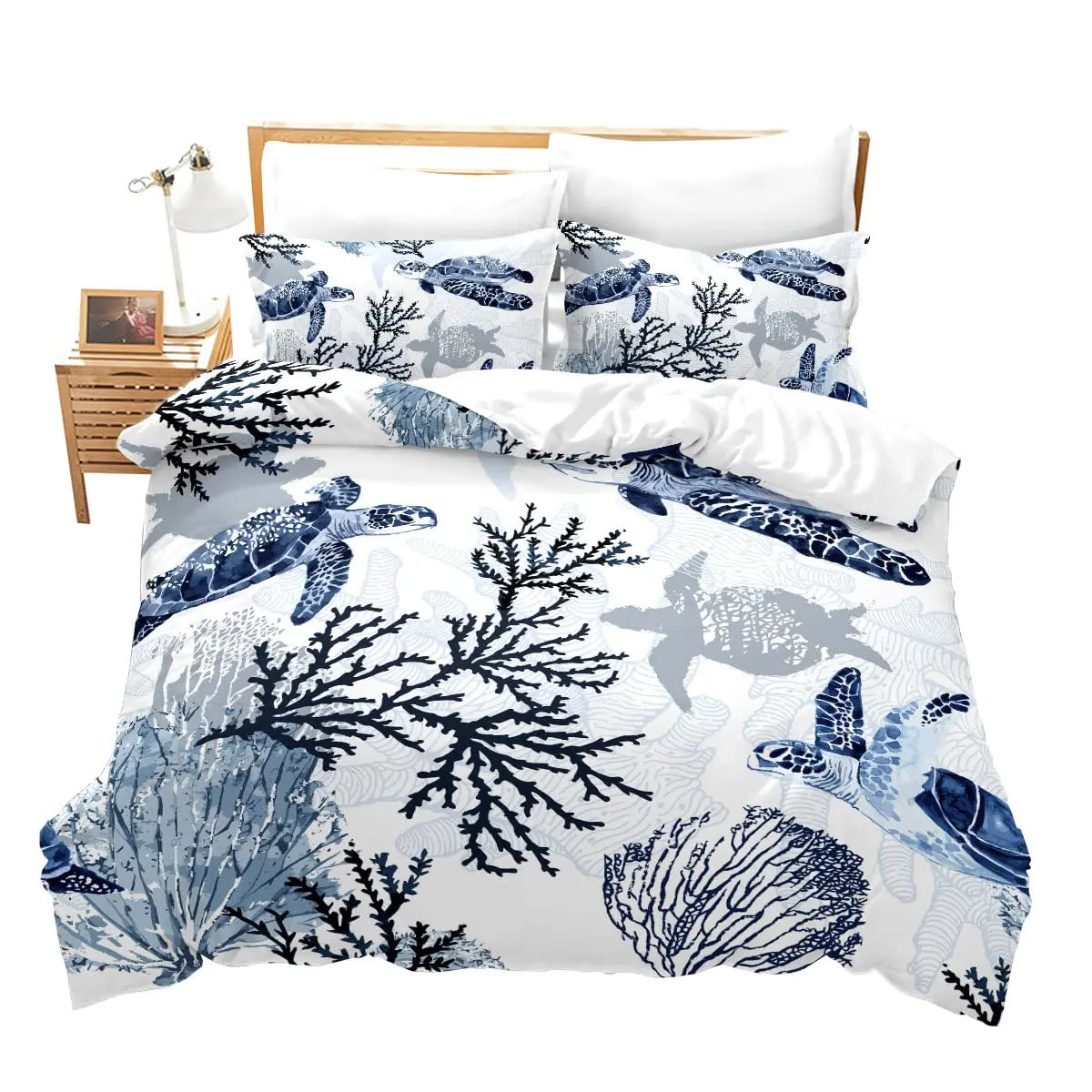 A set of sea turtle patterned duvet covers and pillows with a white background.