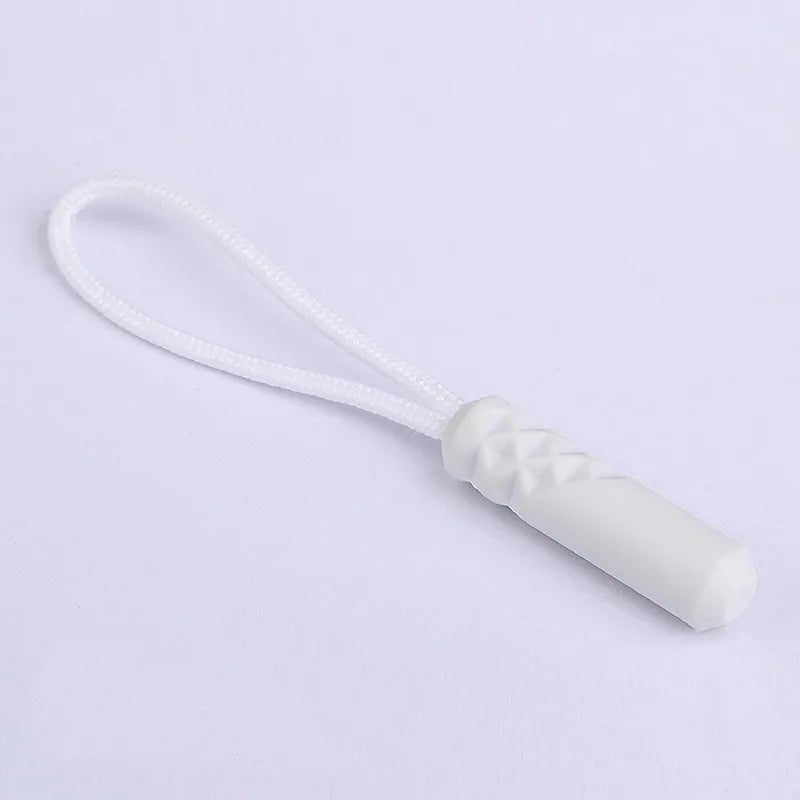 A white zipper pull replacement clip with a white cord is shown against a white background.