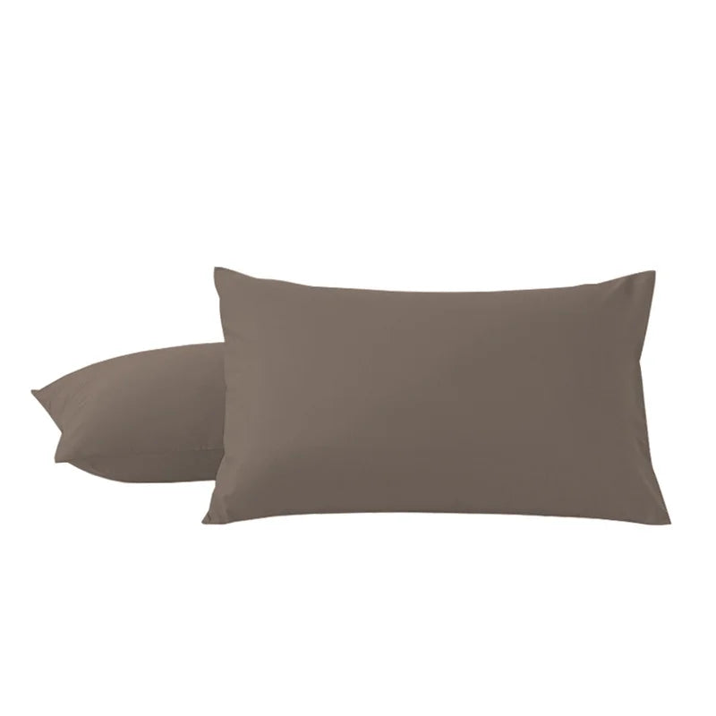 A pair of solid brown microfiber pillow covers lying side by side.