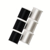Rolls of black and silver invisible nylon sewing thread stacked diagonally