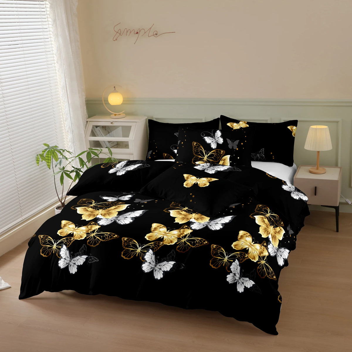 Black duvet cover set with gold and white butterfly print displayed on a bed in a light-colored room.