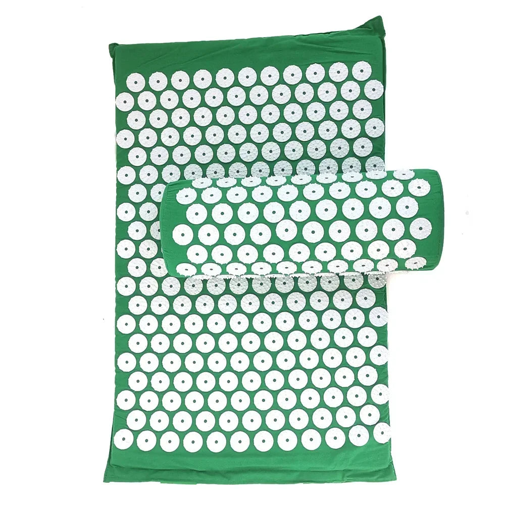 A green acupressure relief mat and pillow set covered in white dots for pain and stress relief.
