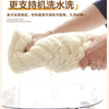 A hand is holding a fluffy white fabric product, likely a sofa armrest cover, above a glass bowl.