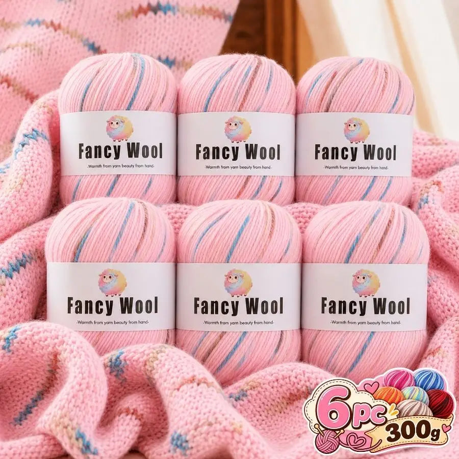 A set of pink gradient alpaca wool yarn skeins for knitting and crochet projects.