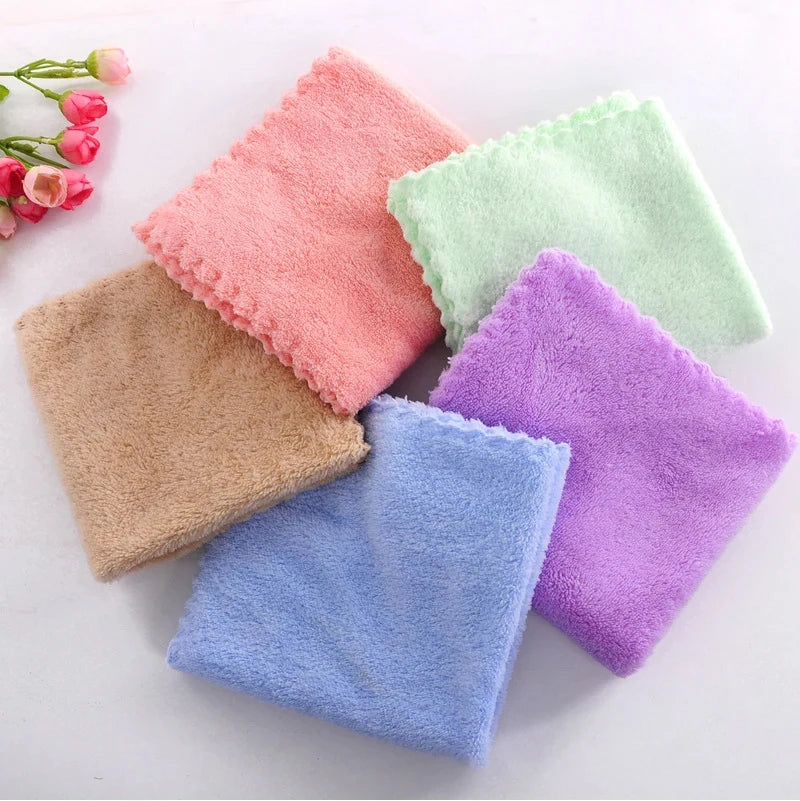 A set of ten luxury velvet cleaning face towels in various pastel colors including pink, green, beige, and purple.