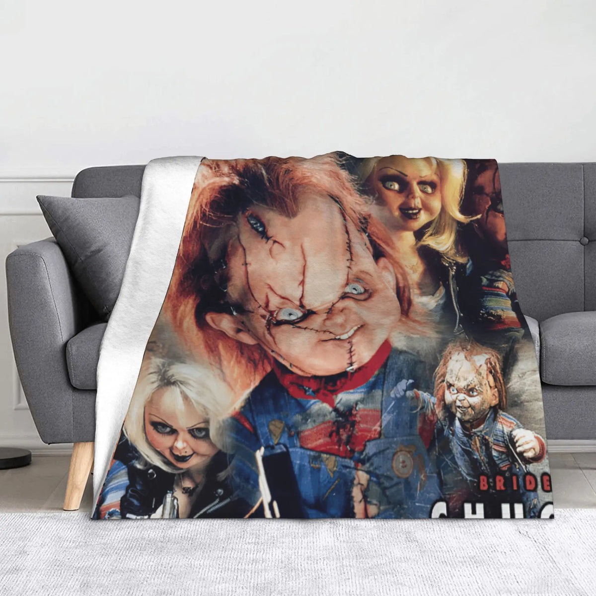 A flannel throw blanket featuring a collage of Chucky horror movie characters.