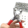 A hand holds a pair of silver pliers with red handles, next to a box of fasteners.